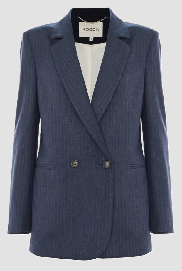 grey jacket woman blue night