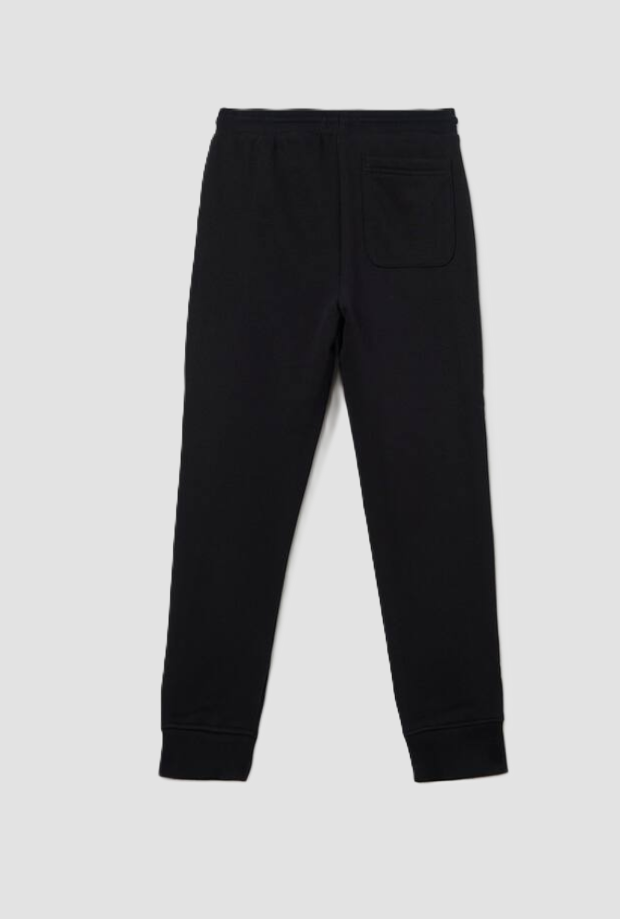 pantalones con mini insignia niño negro
